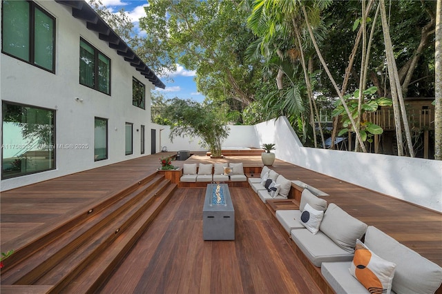 deck with fence and outdoor lounge area