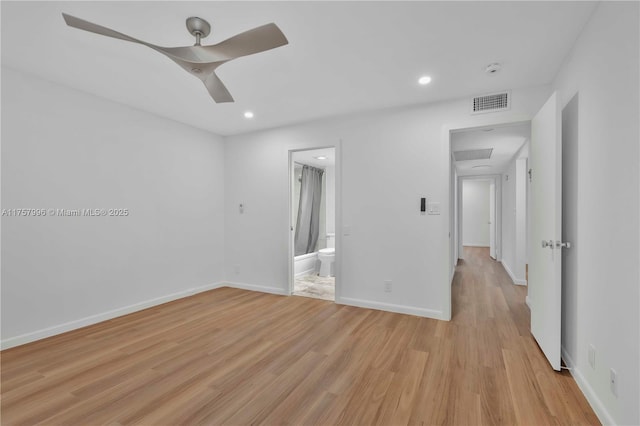 spare room featuring light wood finished floors, recessed lighting, visible vents, a ceiling fan, and baseboards