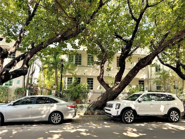 view of property hidden behind natural elements