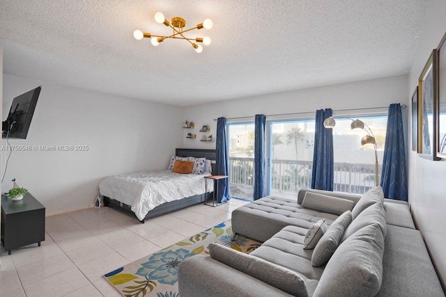 bedroom with a notable chandelier, light tile patterned floors, access to outside, and a textured ceiling