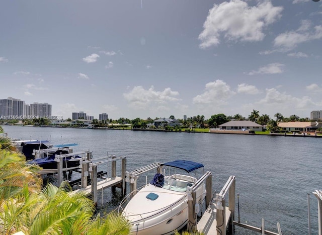 view of dock with a view of city, a water view, and boat lift