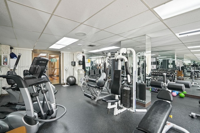 exercise room featuring a paneled ceiling