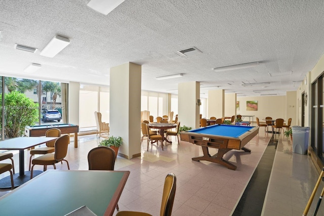 game room featuring plenty of natural light, visible vents, billiards, and a textured ceiling