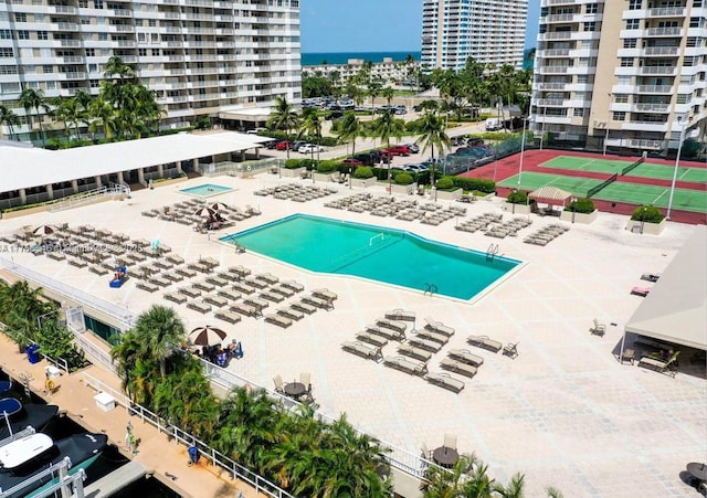 view of pool featuring a view of city and a water view