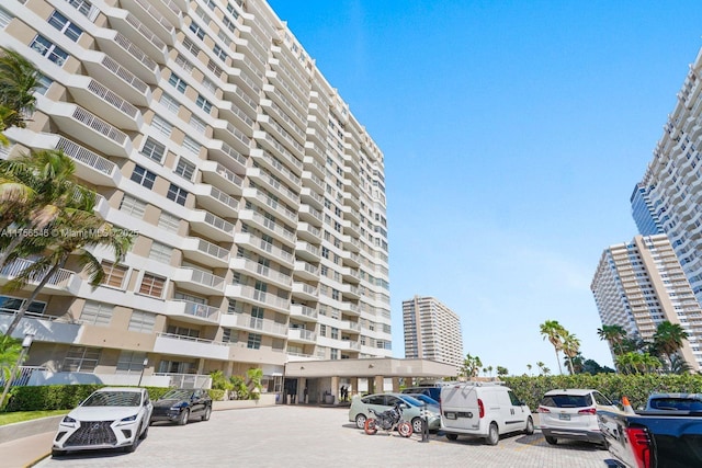 view of property featuring uncovered parking