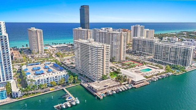 birds eye view of property featuring a water view and a city view