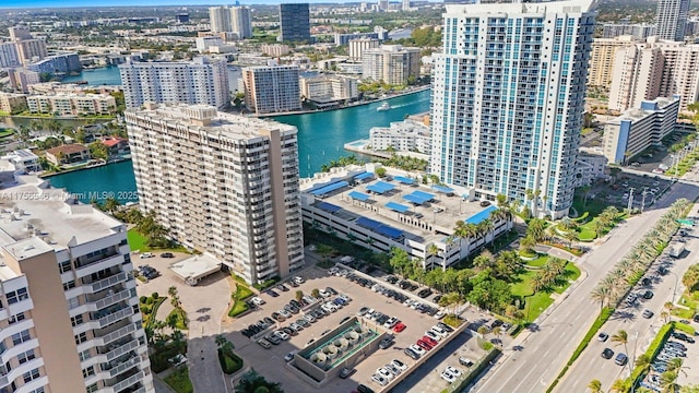 bird's eye view featuring a water view and a city view