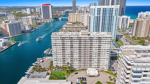 drone / aerial view with a view of city and a water view