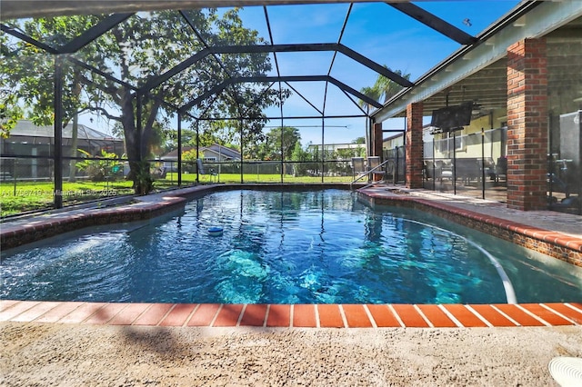 view of pool with a lanai, a fenced in pool, and a patio area