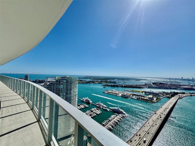 balcony featuring a water view