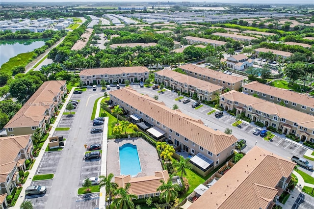 bird's eye view with a water view and a residential view