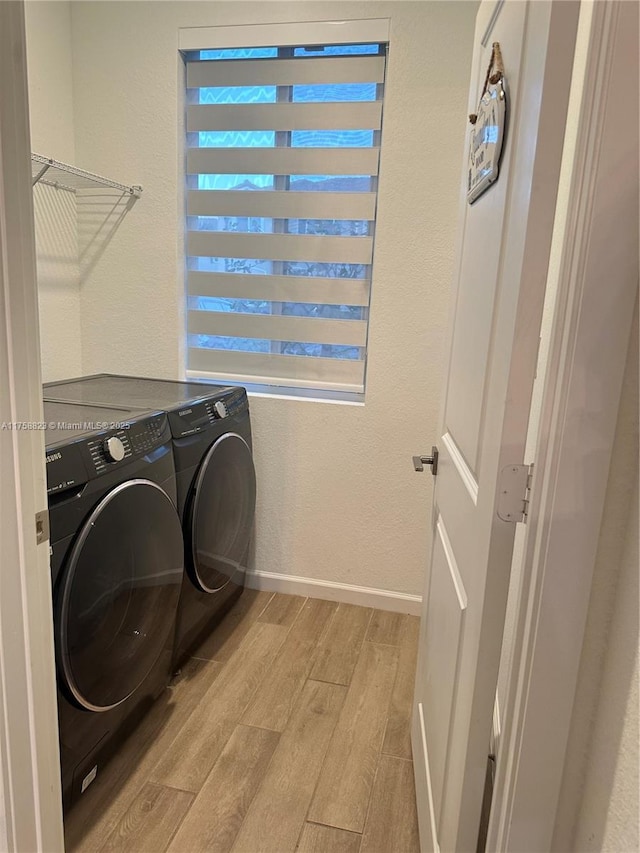 2431 SE 10th Ct, Homestead, FL 33035 - laundry area featuring a wealth of natural light, laundry area, light wood-style floors, and washer and clothes dryer