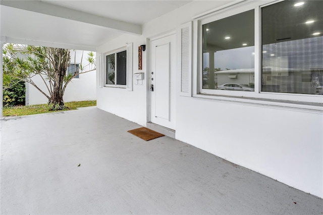 doorway to property with stucco siding