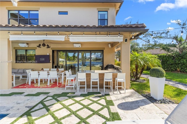 view of patio / terrace featuring outdoor wet bar