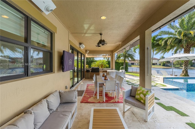 view of patio with outdoor dining area, a fenced in pool, and an outdoor hangout area