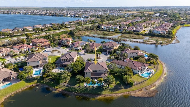 bird's eye view with a residential view and a water view