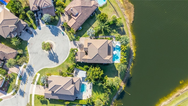 birds eye view of property with a residential view