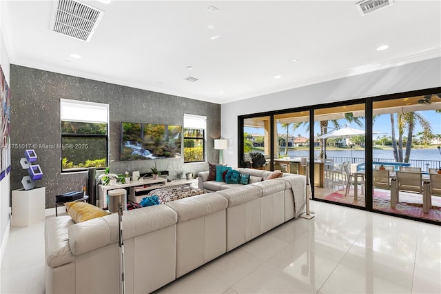 living room featuring recessed lighting, visible vents, ornamental molding, and light tile patterned flooring