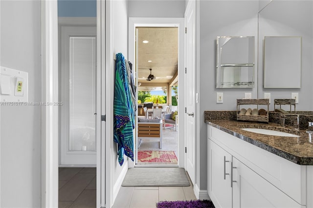 bathroom featuring tile patterned flooring and vanity