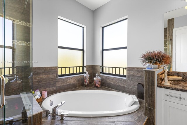 11360 NW 83rd Way, Parkland, FL 33076 - bathroom featuring a shower stall, a garden tub, and vanity