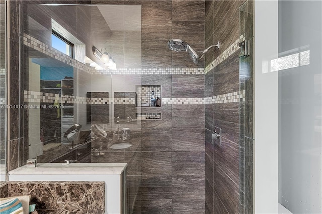 full bath featuring a tile shower