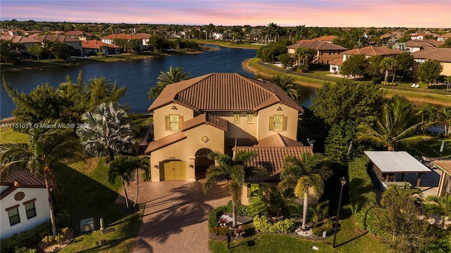 bird's eye view featuring a residential view and a water view