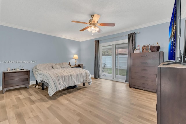 bedroom featuring light wood finished floors, a textured ceiling, crown molding, and access to outside