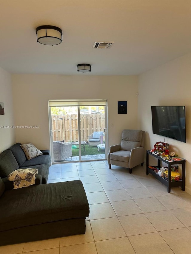 living room with visible vents and light tile patterned flooring