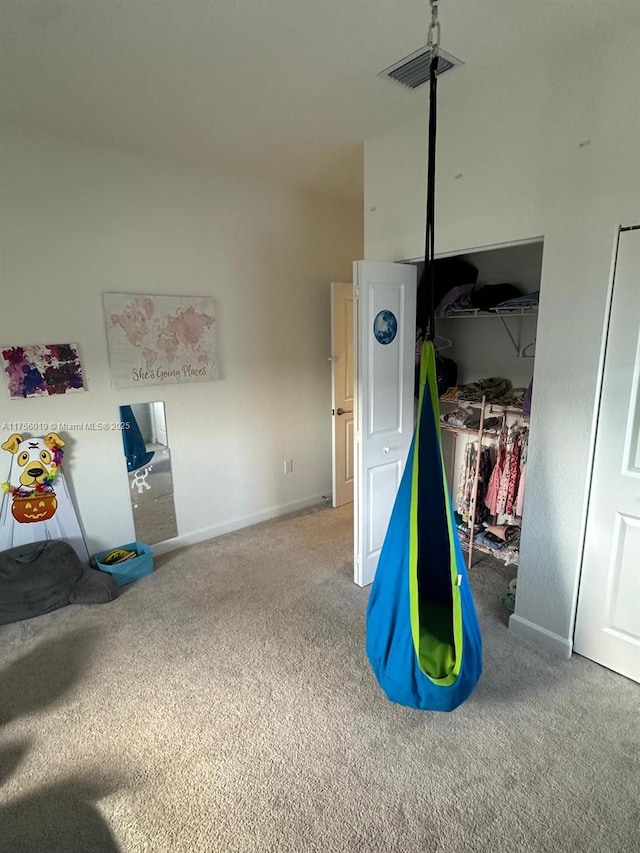 playroom featuring carpet flooring, visible vents, and baseboards