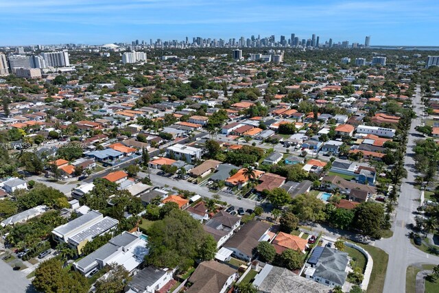 birds eye view of property with a view of city