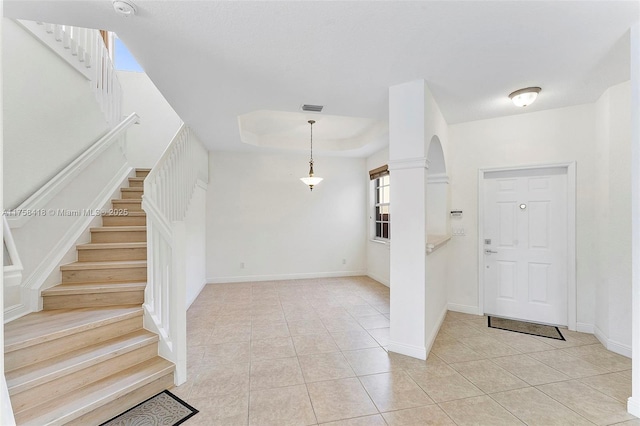 5220 SW 139th Ter, Miramar, FL 33027 - entryway with light tile patterned floors, stairway, arched walkways, and a tray ceiling