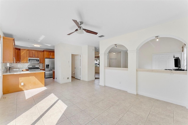 5220 SW 139th Ter, Miramar, FL 33027 - kitchen featuring stainless steel appliances, ceiling fan, light countertops, and light tile patterned flooring