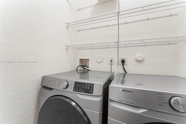 5220 SW 139th Ter, Miramar, FL 33027 - laundry room with a textured wall and washer and clothes dryer