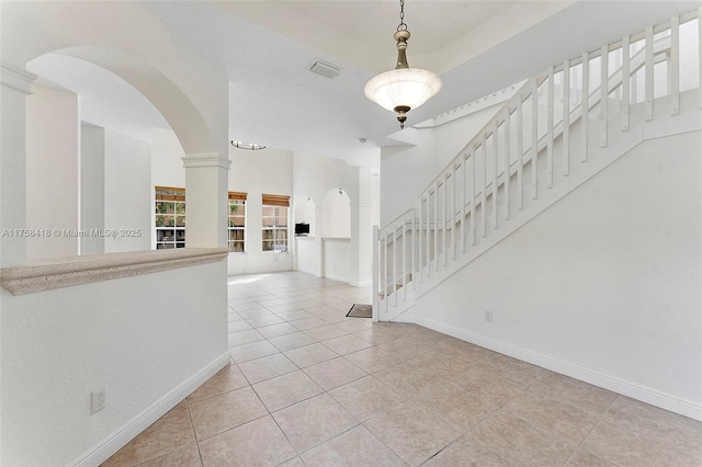 5220 SW 139th Ter, Miramar, FL 33027 - entryway with tile patterned floors, arched walkways, and stairway