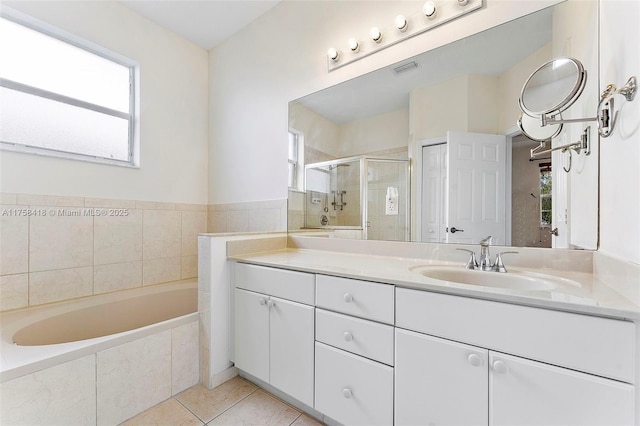 5220 SW 139th Ter, Miramar, FL 33027 - bathroom with vanity, a bath, healthy amount of natural light, and tile patterned floors