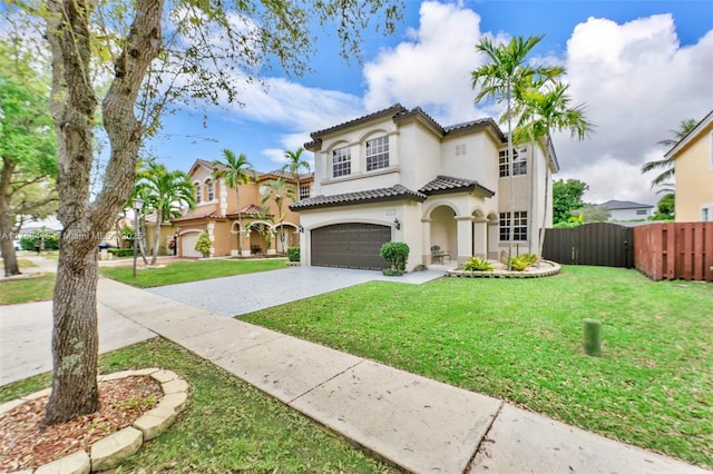 5220 SW 139th Ter, Miramar, FL 33027 - mediterranean / spanish house with stucco siding, driveway, a tiled roof, and an attached garage
