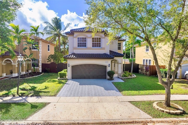 5220 SW 139th Ter, Miramar, FL 33027 - mediterranean / spanish-style house with a tiled roof, stucco siding, decorative driveway, and a garage