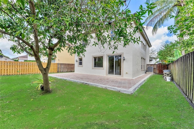 5220 SW 139th Ter, Miramar, FL 33027 - rear view of property with stucco siding, a patio, and a fenced backyard