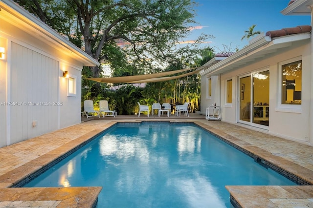 outdoor pool featuring a patio