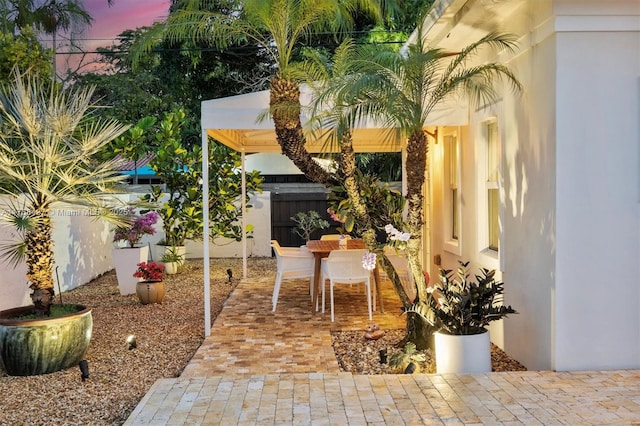 view of patio / terrace featuring fence