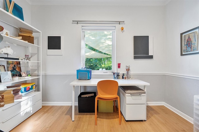 office area with light wood-type flooring and baseboards