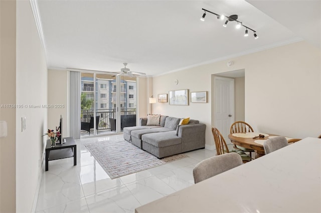 2665 SW 37th Ave Unit 612, Miami, FL 33133 - living room featuring crown molding, light marble finish flooring, ceiling fan, and baseboards