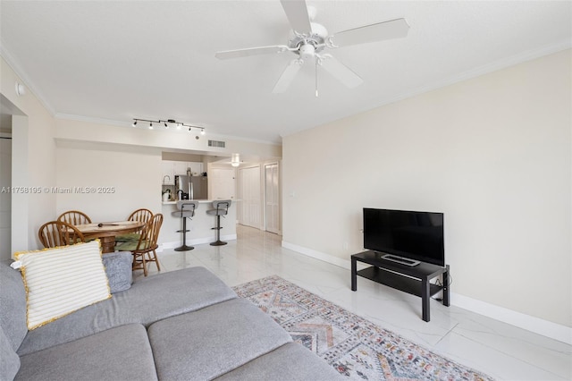 2665 SW 37th Ave Unit 612, Miami, FL 33133 - living area with light marble finish flooring, ornamental molding, a ceiling fan, and baseboards