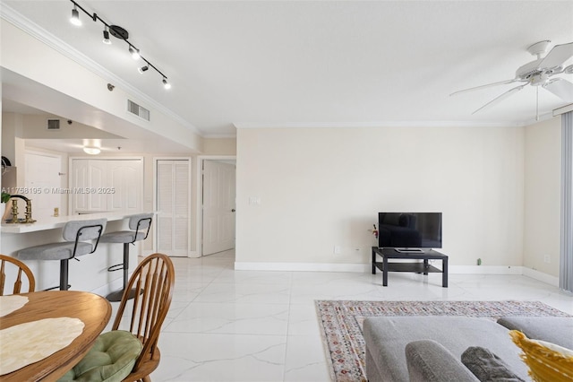 2665 SW 37th Ave Unit 612, Miami, FL 33133 - living room featuring light marble finish flooring, crown molding, ceiling fan, and baseboards