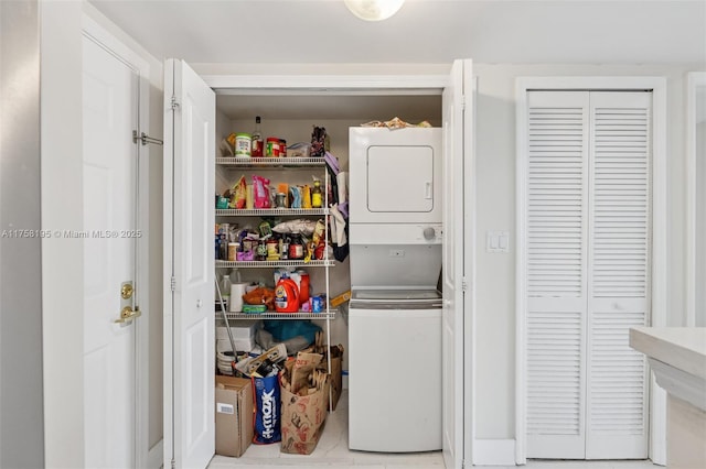 2665 SW 37th Ave Unit 612, Miami, FL 33133 - clothes washing area featuring estacked washer and dryer