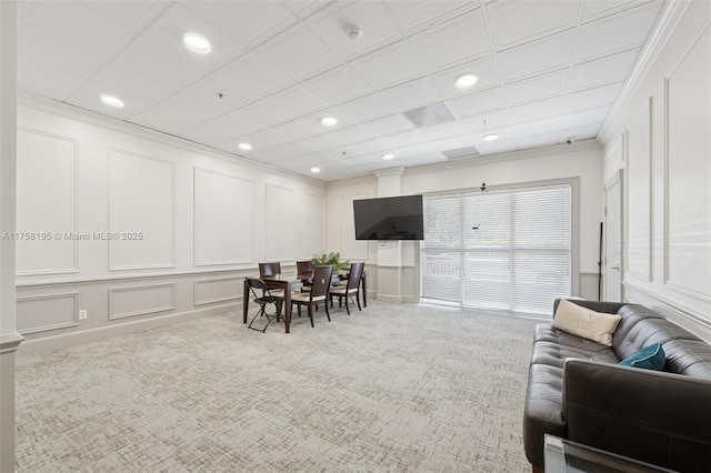 2665 SW 37th Ave Unit 612, Miami, FL 33133 - carpeted living area featuring a decorative wall, recessed lighting, and ornamental molding