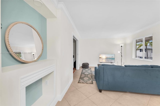 living room with baseboards, ornamental molding, and light tile patterned flooring