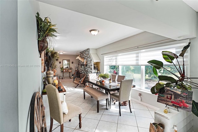 dining area with light tile patterned floors and baseboards