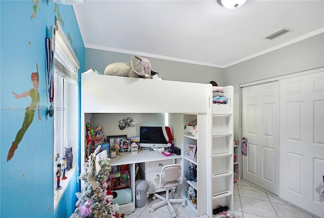 tiled bedroom featuring a closet, visible vents, and crown molding