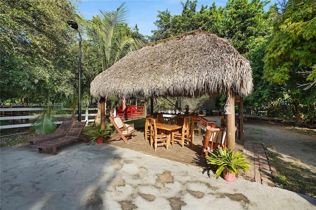 view of patio / terrace featuring a gazebo and fence